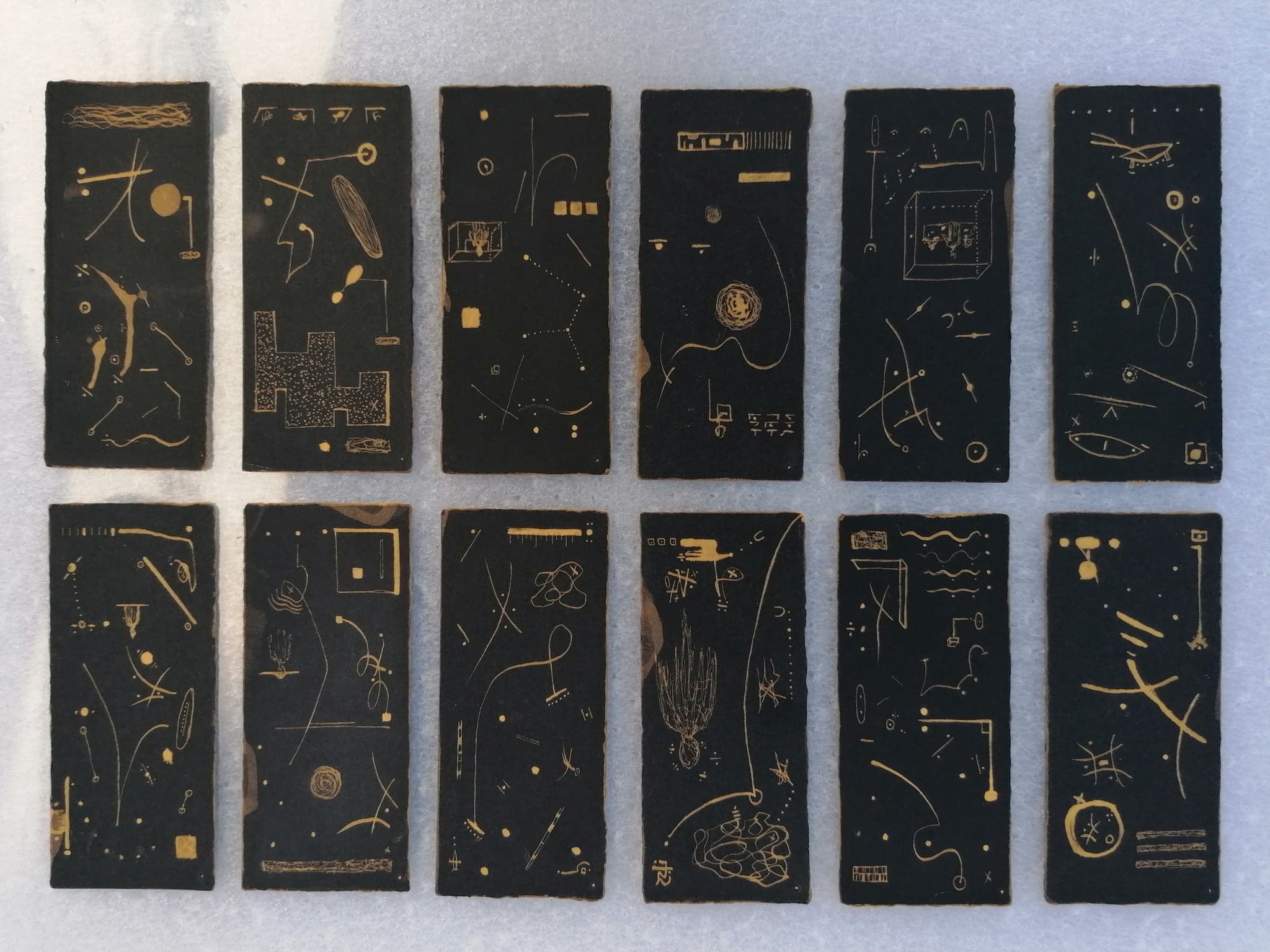 The same twelve cards laid out in two rows of six, seen from directly above