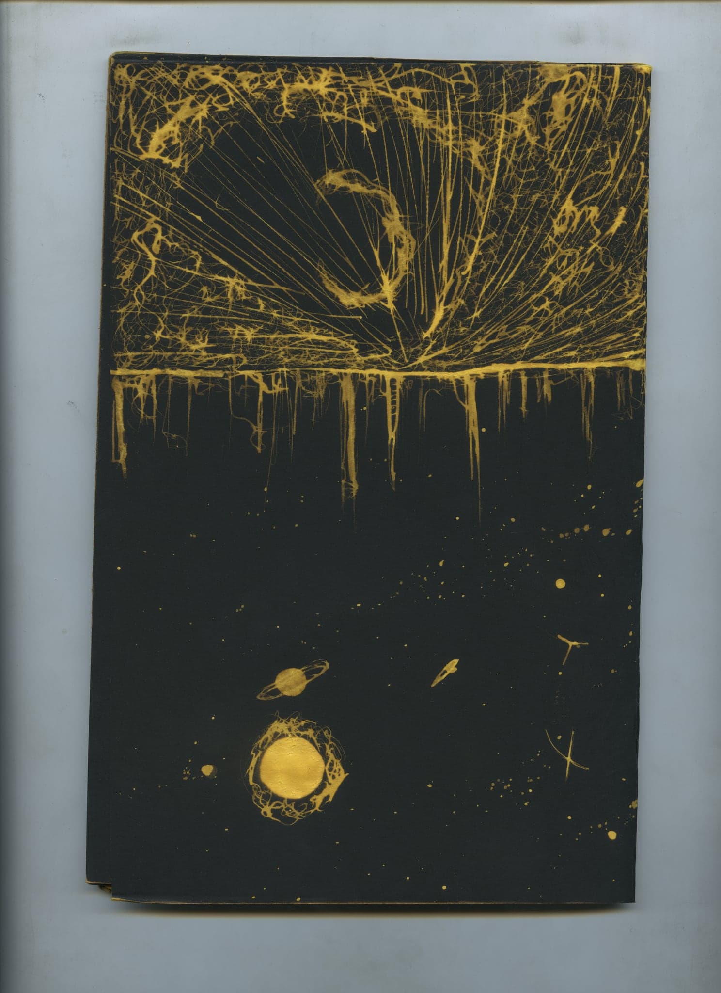 Gold rays fanning across a black spread with drips falling from them and a small pale planet at the lower right