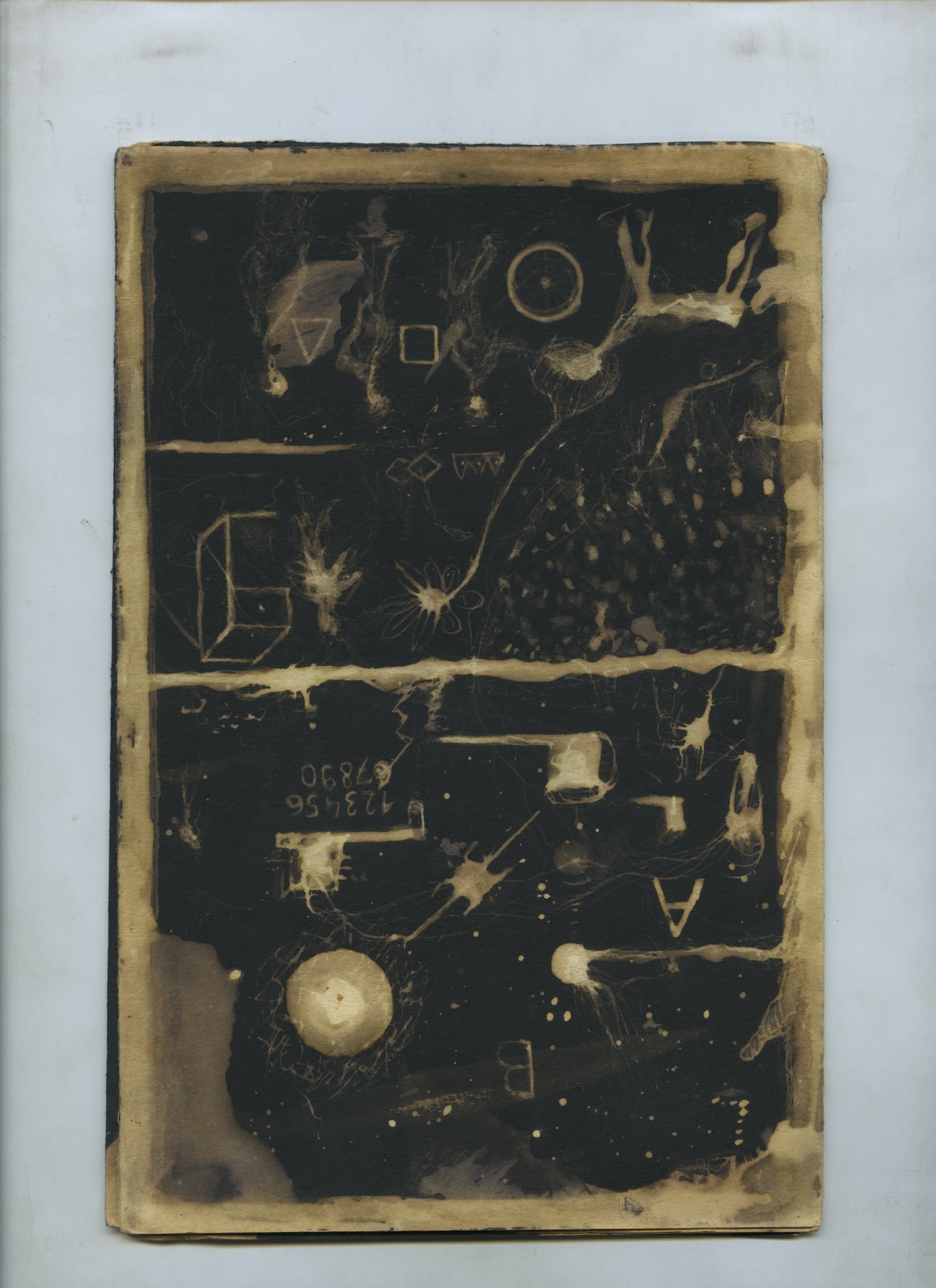 A heavily worked page of small boxes, figures, numbers and dotted paths, its edges bleached to sepia