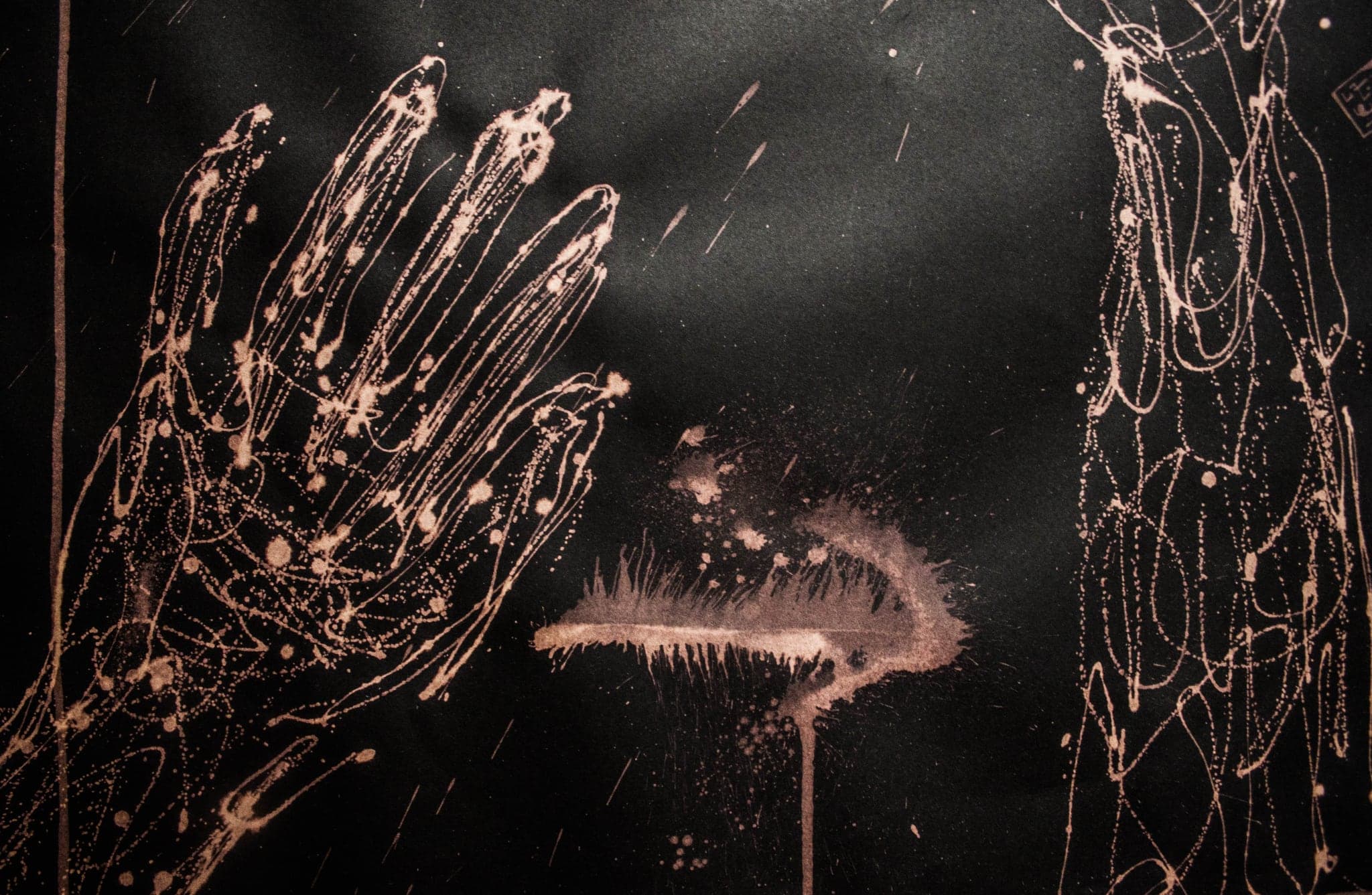 Two hands with fingers splayed wide, drawn pale on near-black.