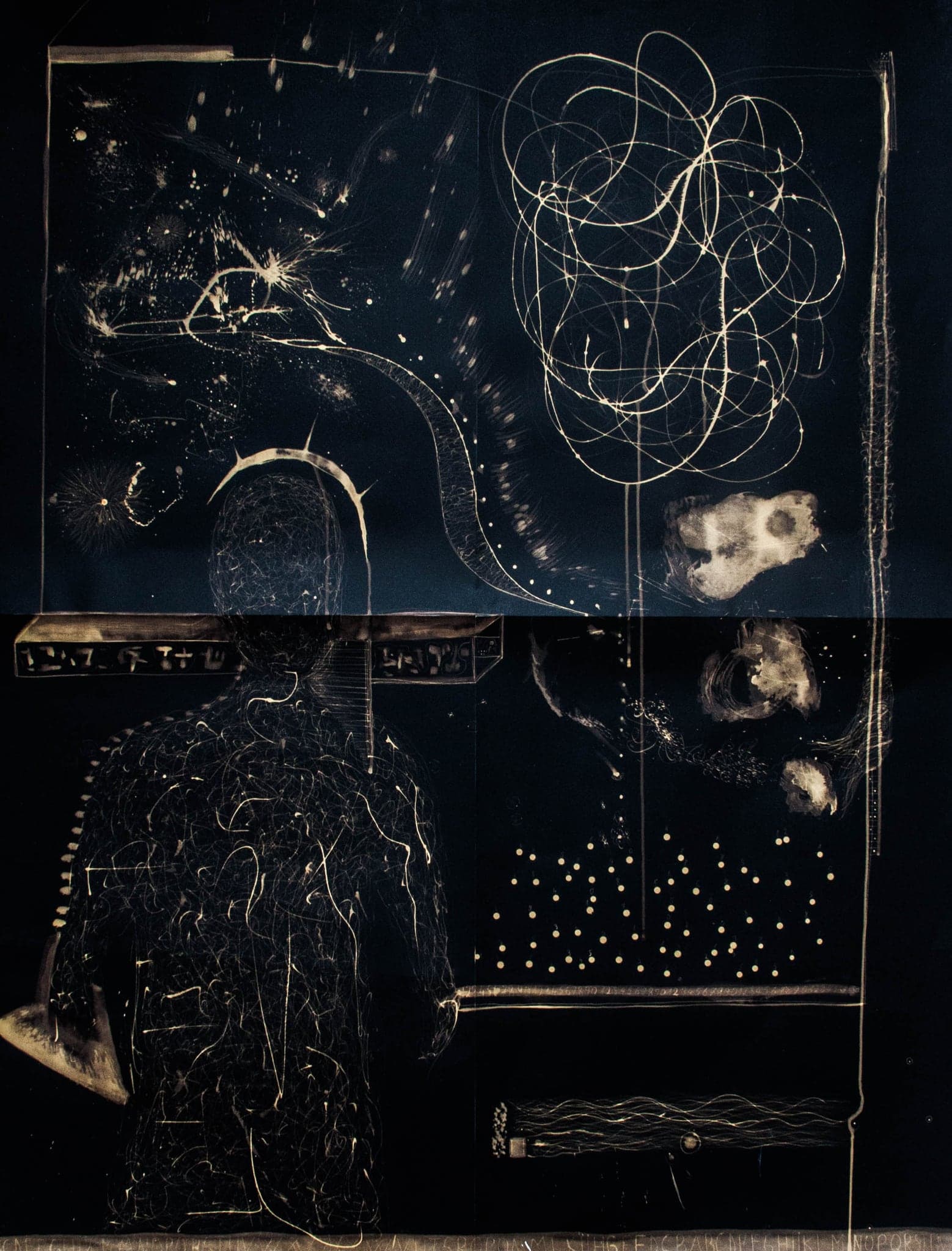 A wide dark sheet with a figure at the left, drawn framed panels beside it and dots scattered across the lower half.