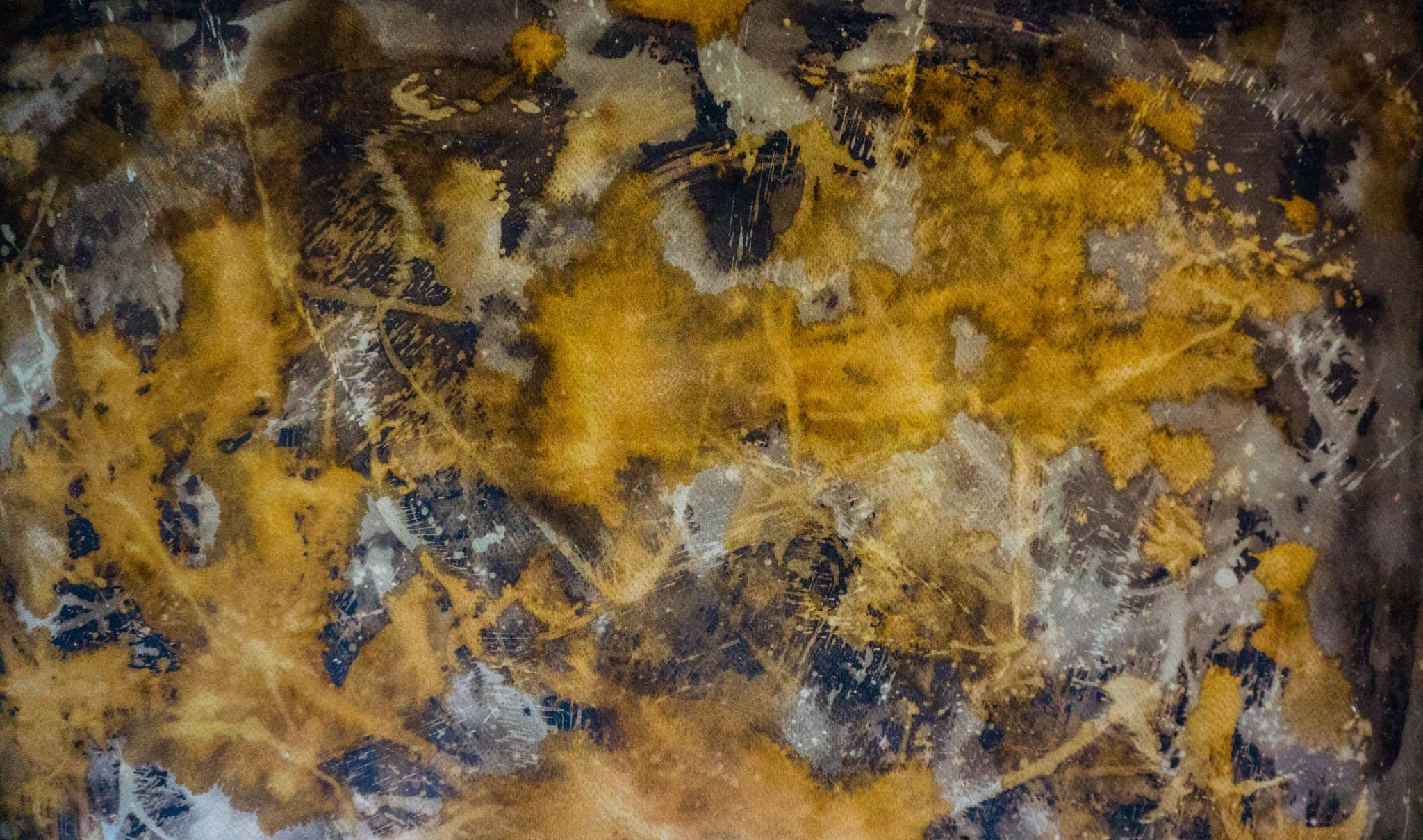 The same surface further along, the gold running in a broad band with grey washes above and below.