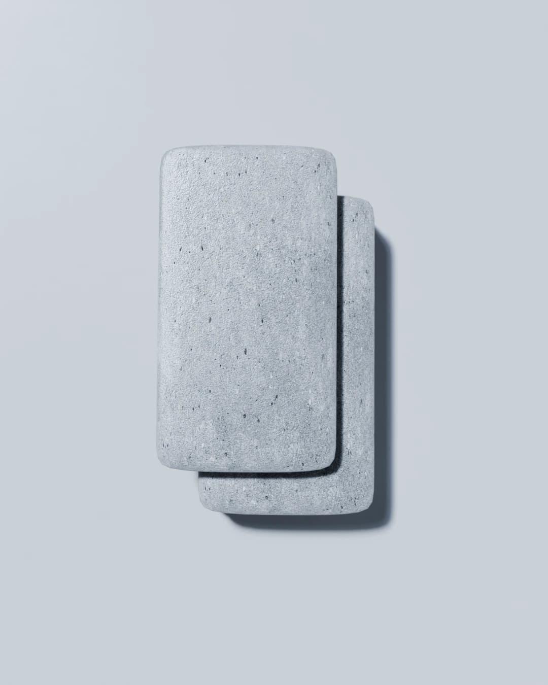 Plan view of the table showing the offset top slab and the speckled concrete surface