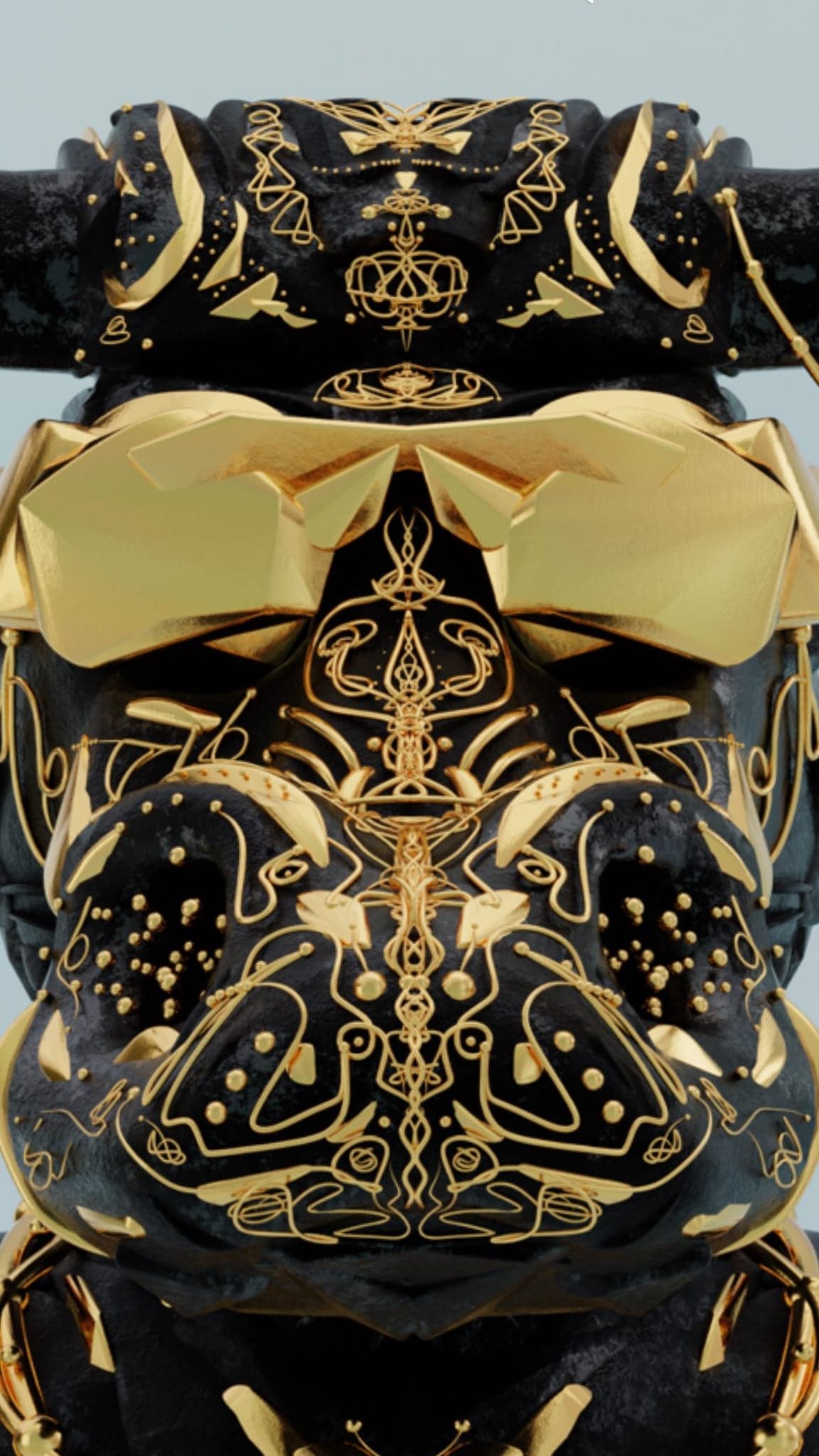 Close-up of a black bull head inlaid with gold filigree and a gold blindfold across the eyes