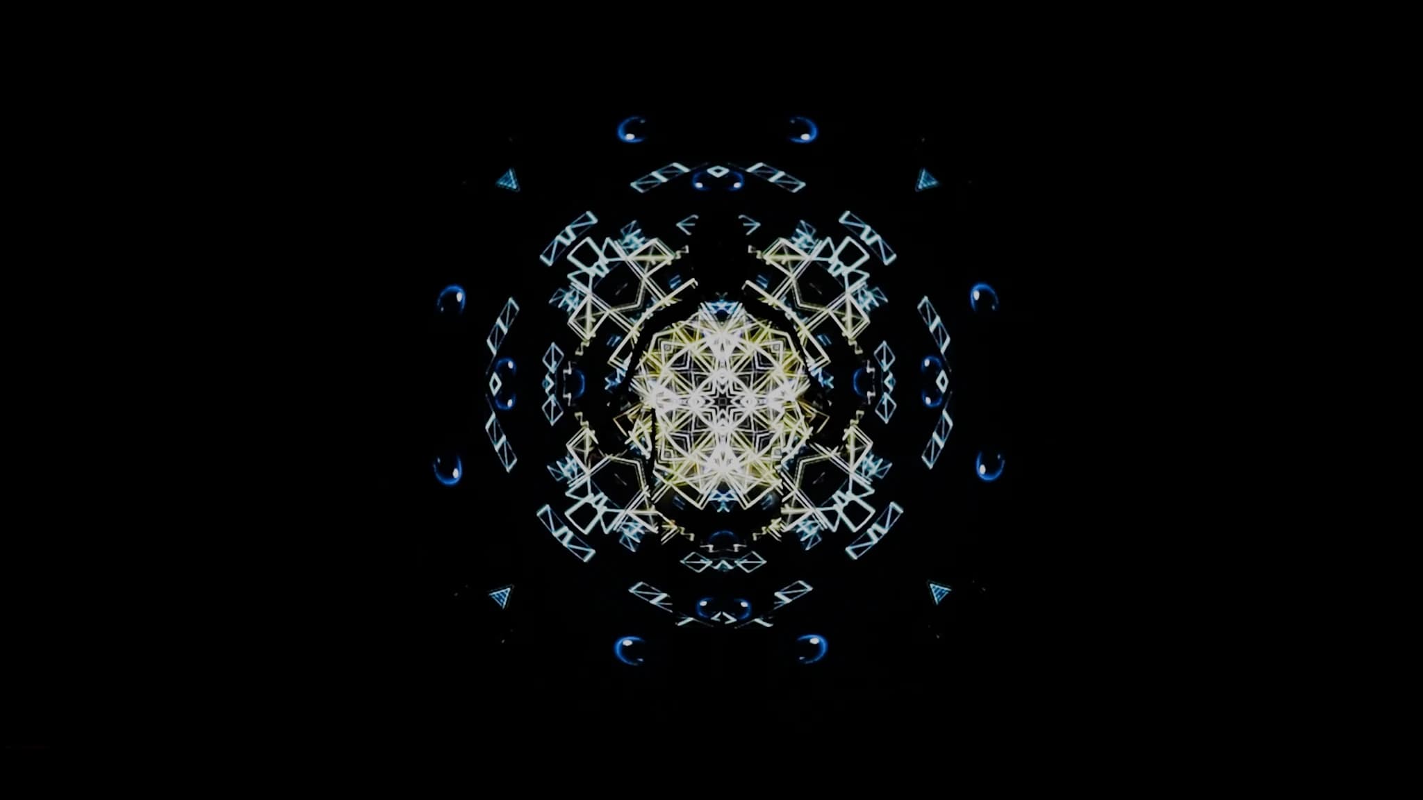 An early frame, the geometry dim and still gathering out of the dark
