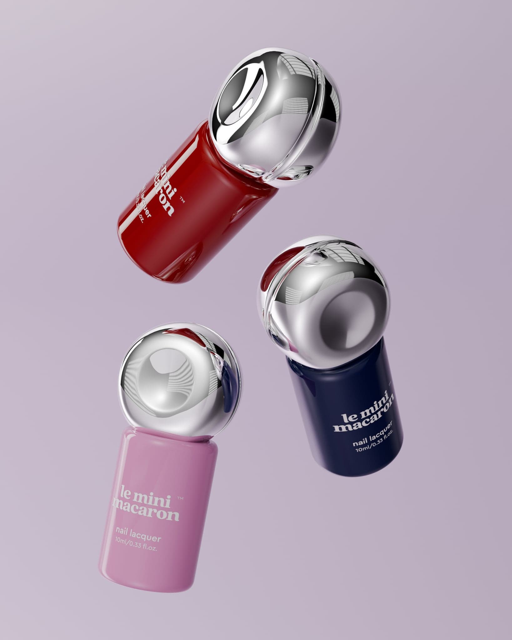Three lacquer bottles — red, pink and navy — floating at angles against lilac, chrome caps catching the light