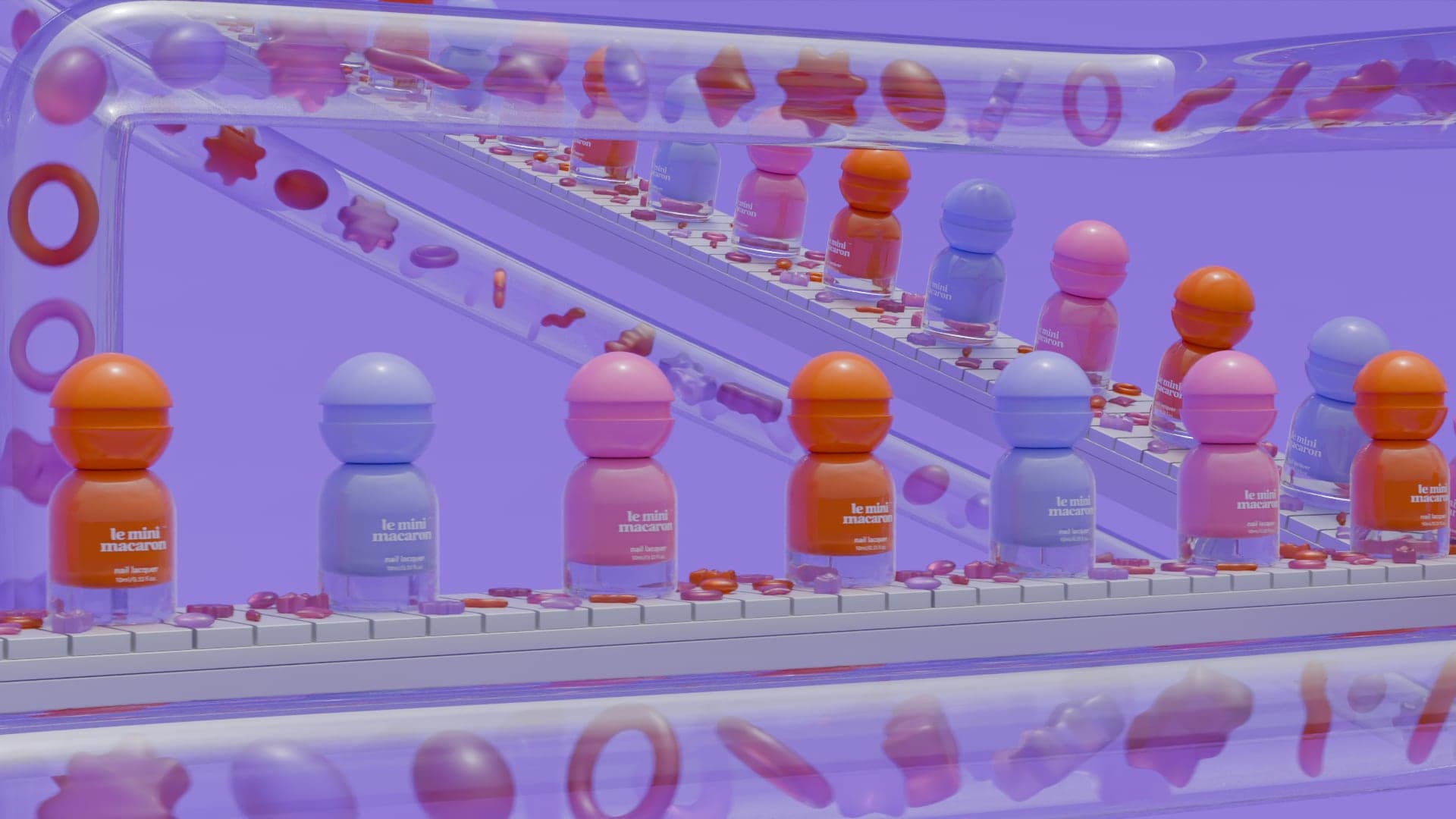Wide view of a long white conveyor belt lined with pink, orange and blue lacquer bottles, a second belt behind it, and clear tubes overhead carrying gummy sweets.