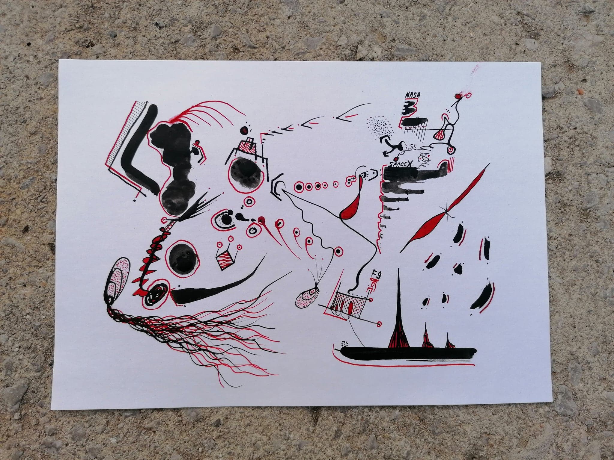 The same drawing lying on a concrete floor in daylight, showing it is a single loose sheet