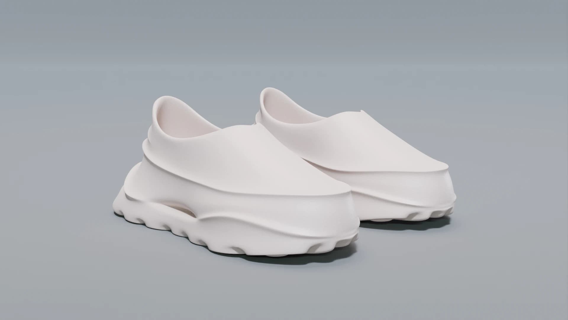 A pair of laceless off-white slip-on sneakers seen at three-quarter angle on a plain grey ground, showing the stepped collar and the ridged sole edge.
