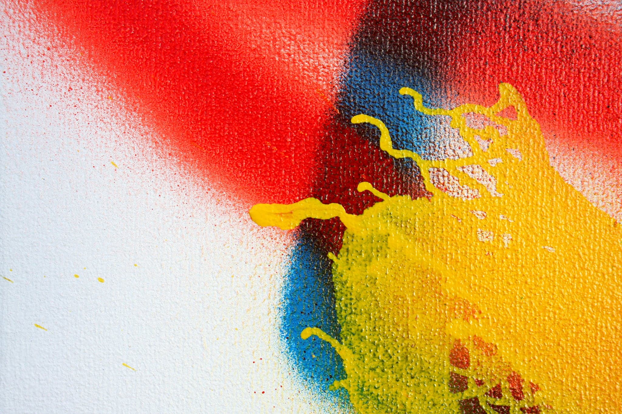 Close view: red laid across yellow with blue behind.