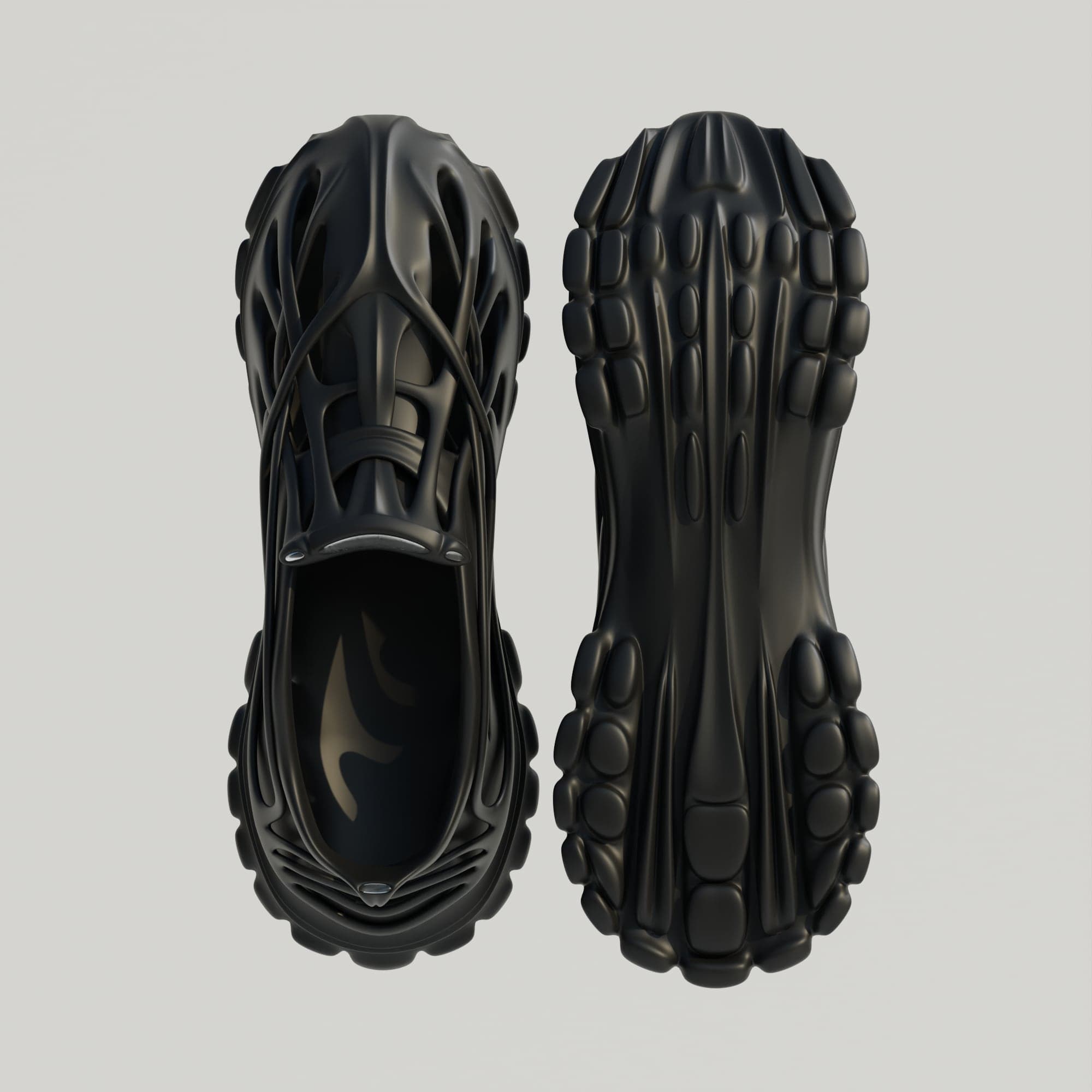 A black version of the shoe seen from directly above beside its outsole, both on a light grey background