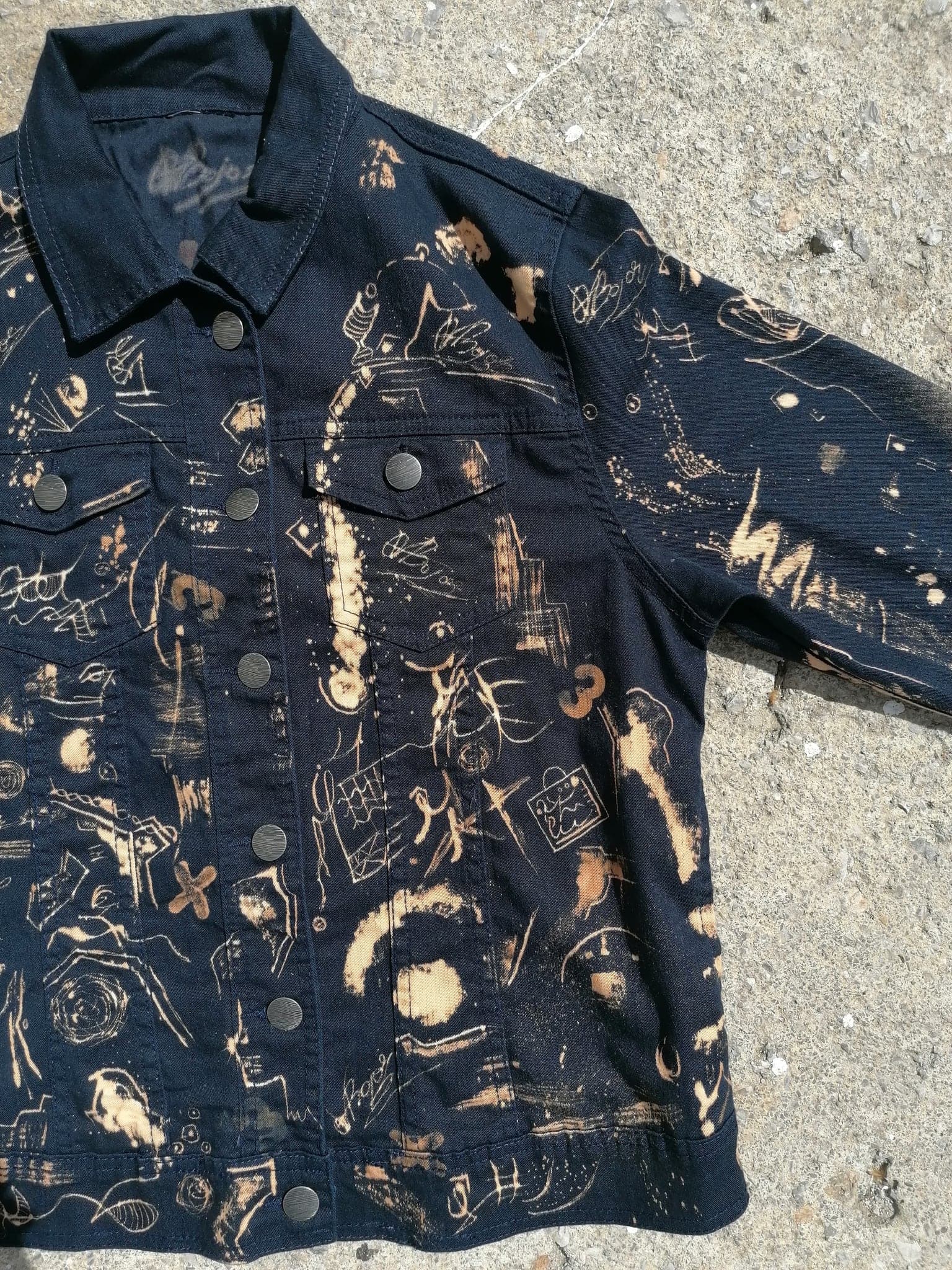 The jacket on concrete seen from the side, the collar turned up