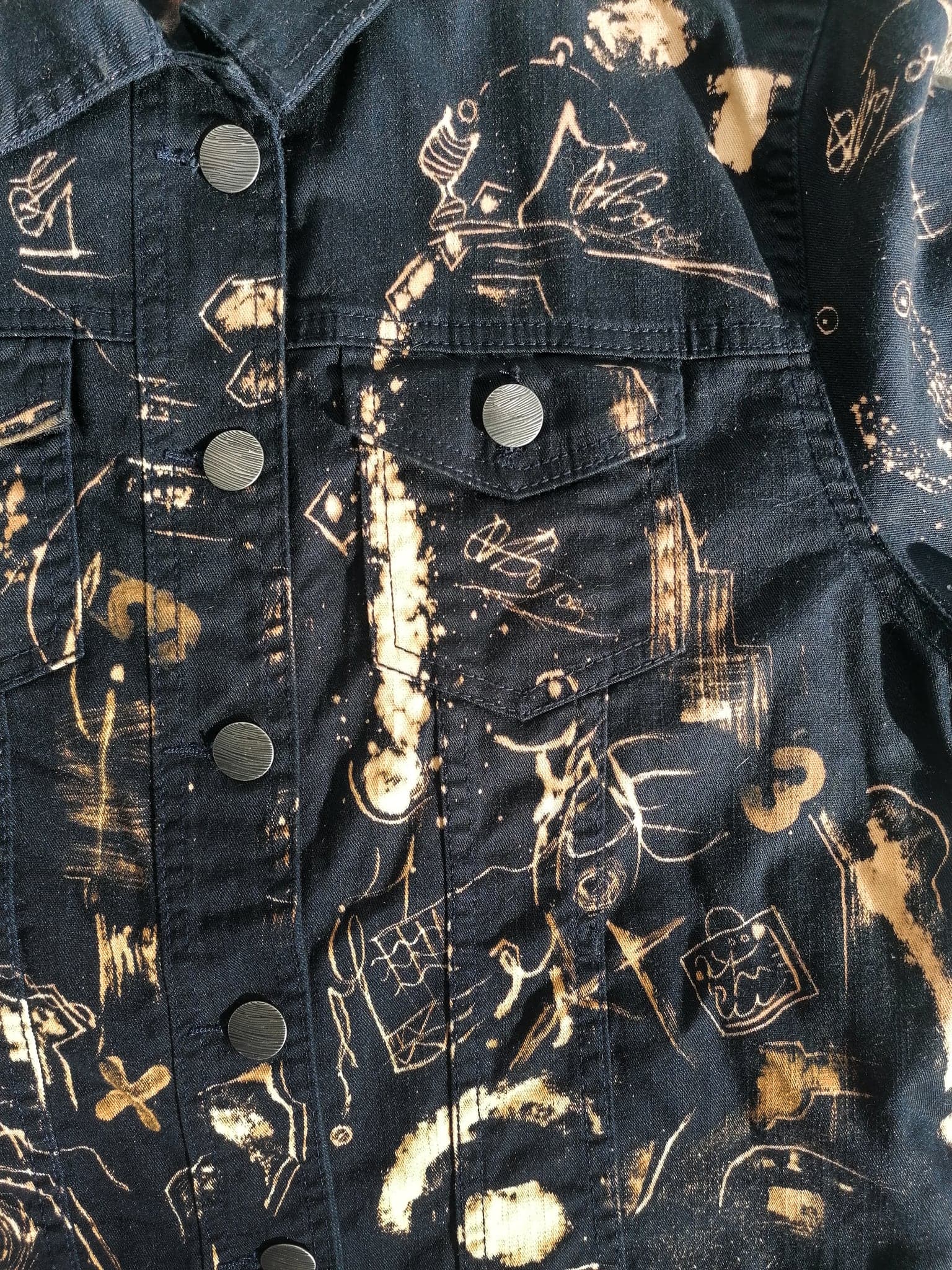 The chest pocket close up, a bright bleached streak running down beside it
