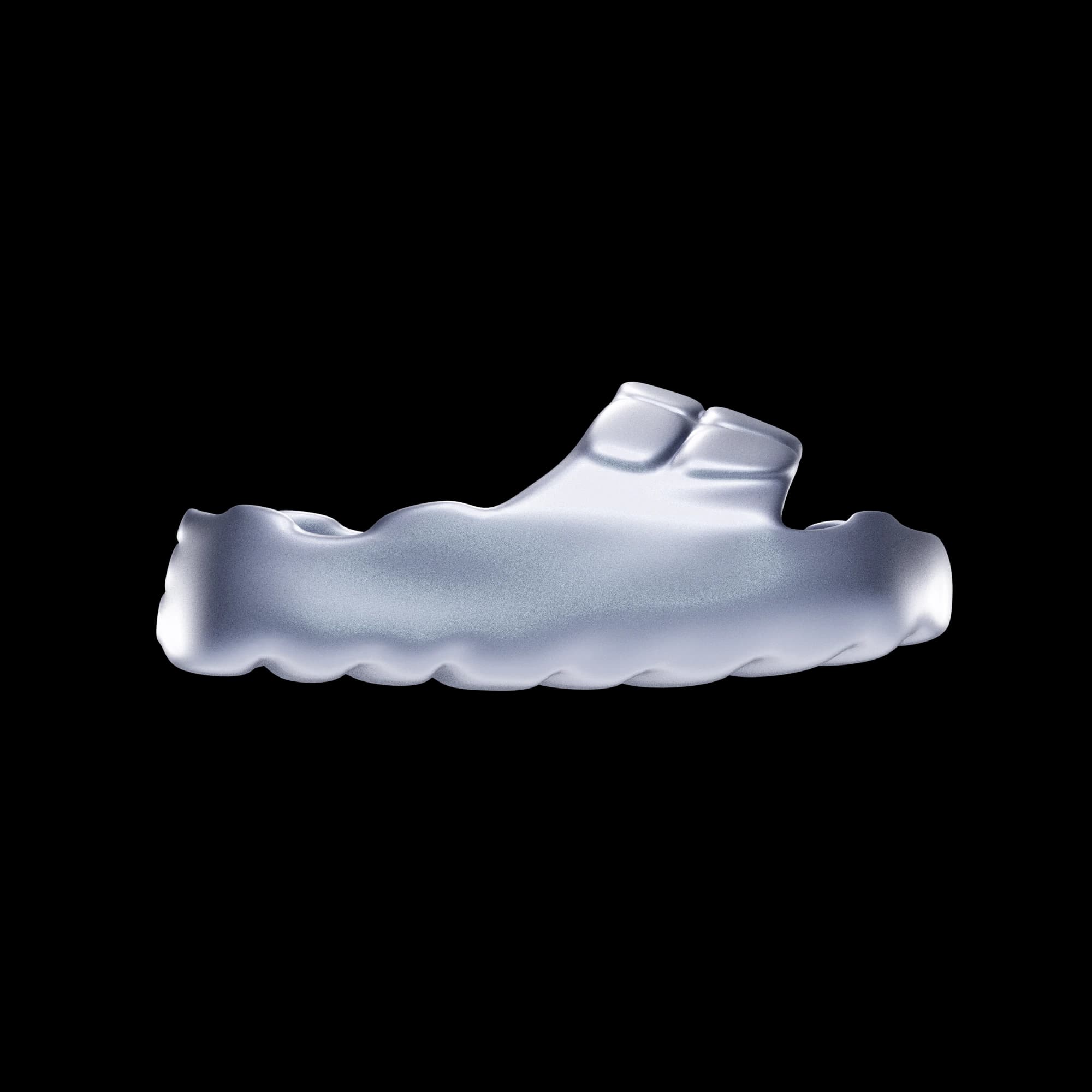 SLIDS footwear concept, a pale, thick single-piece slide sandal with an integrated strap, seen in profile