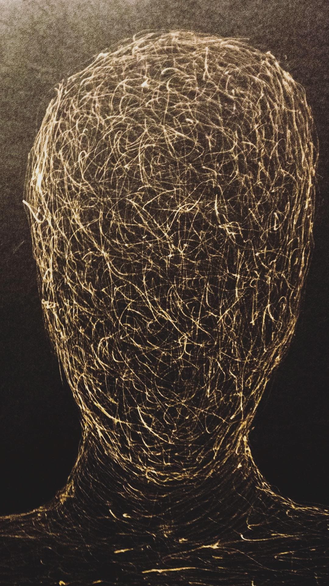 A head front on, drawn as one dense tangle of pale gold line, the strands massing where the skull would be and thinning down the neck