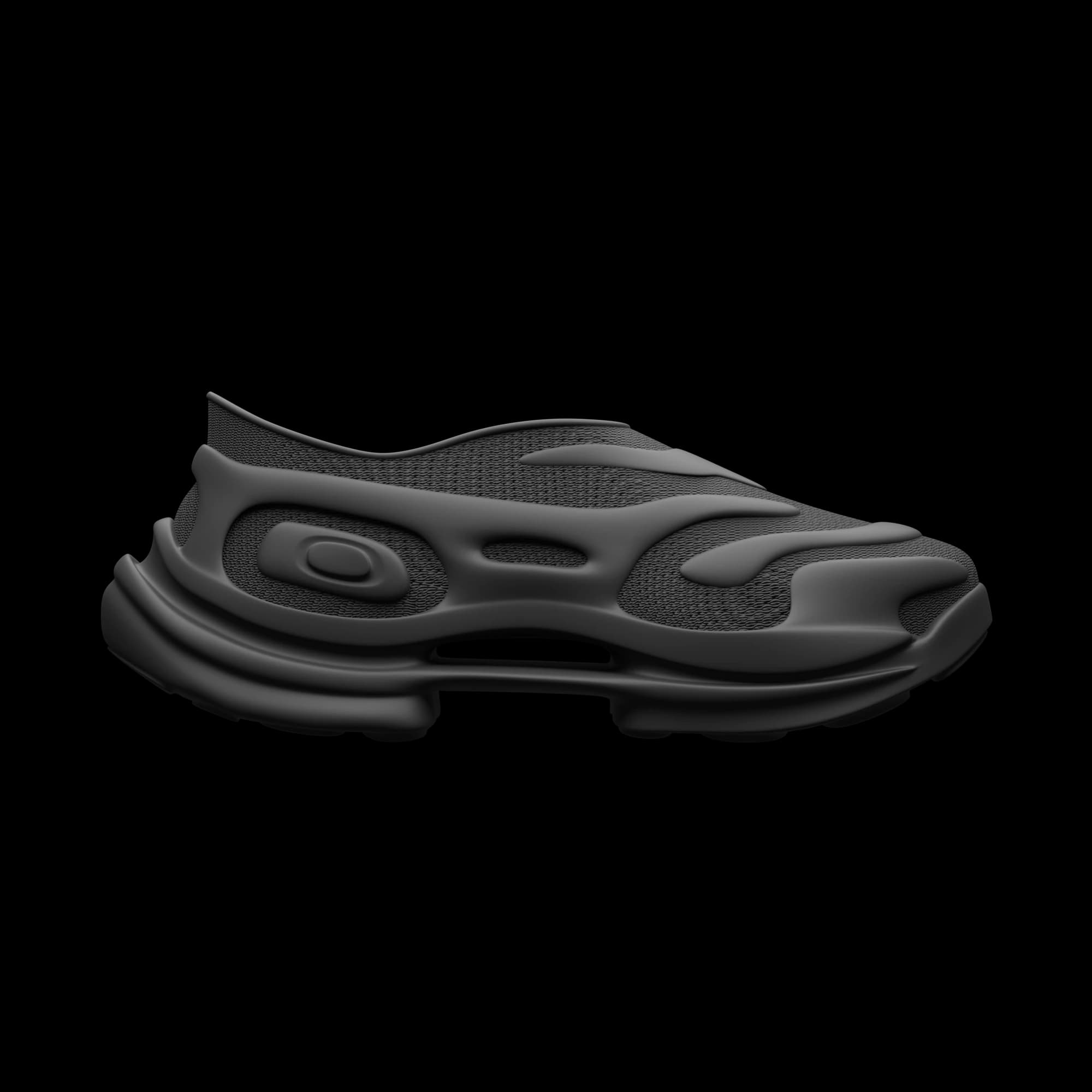 Side view of an all-black slip-on with an organic moulded cage flowing over a mesh upper and a stacked sole.