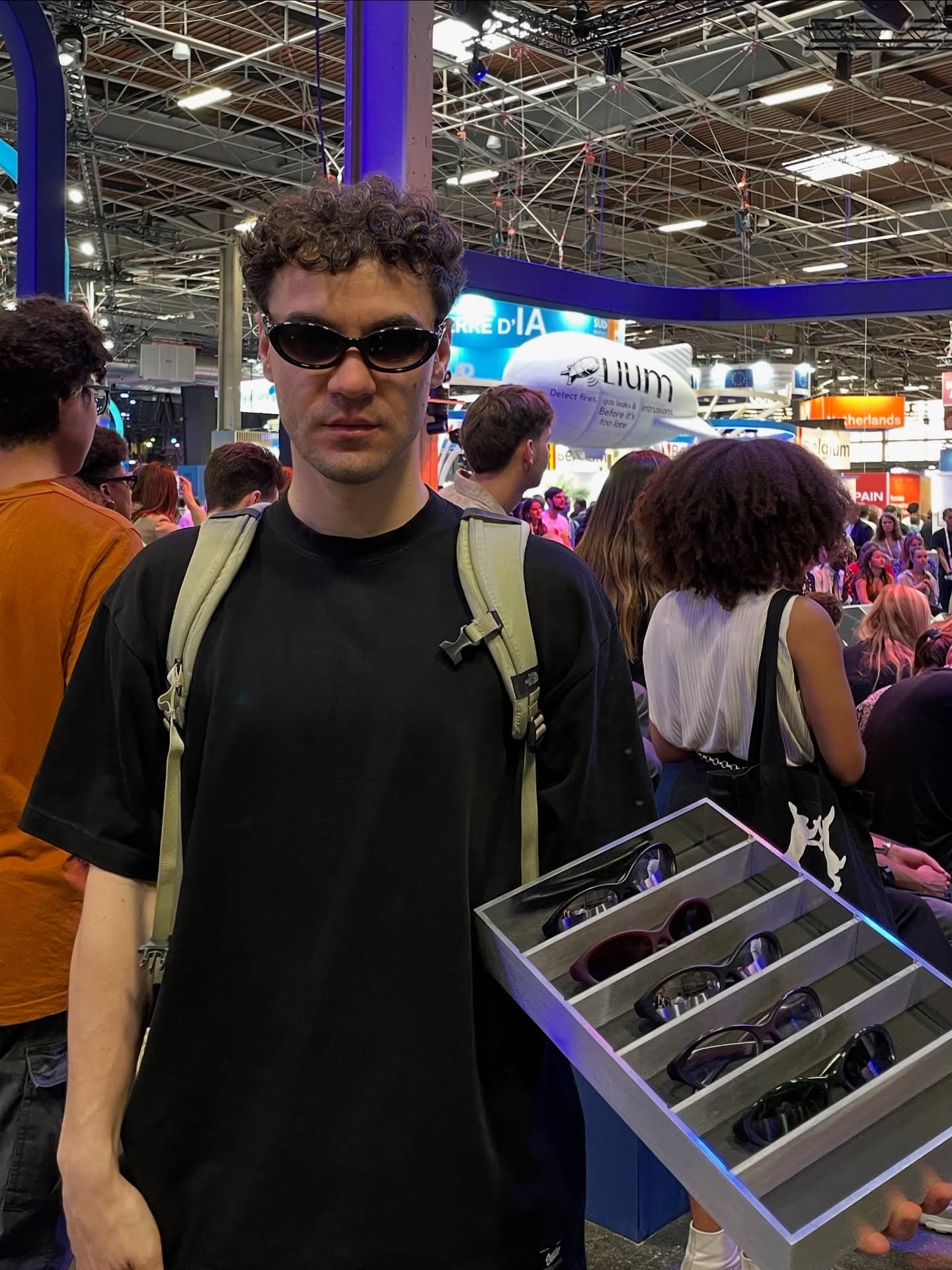 Carrying the tray of frames through the crowded VivaTech floor