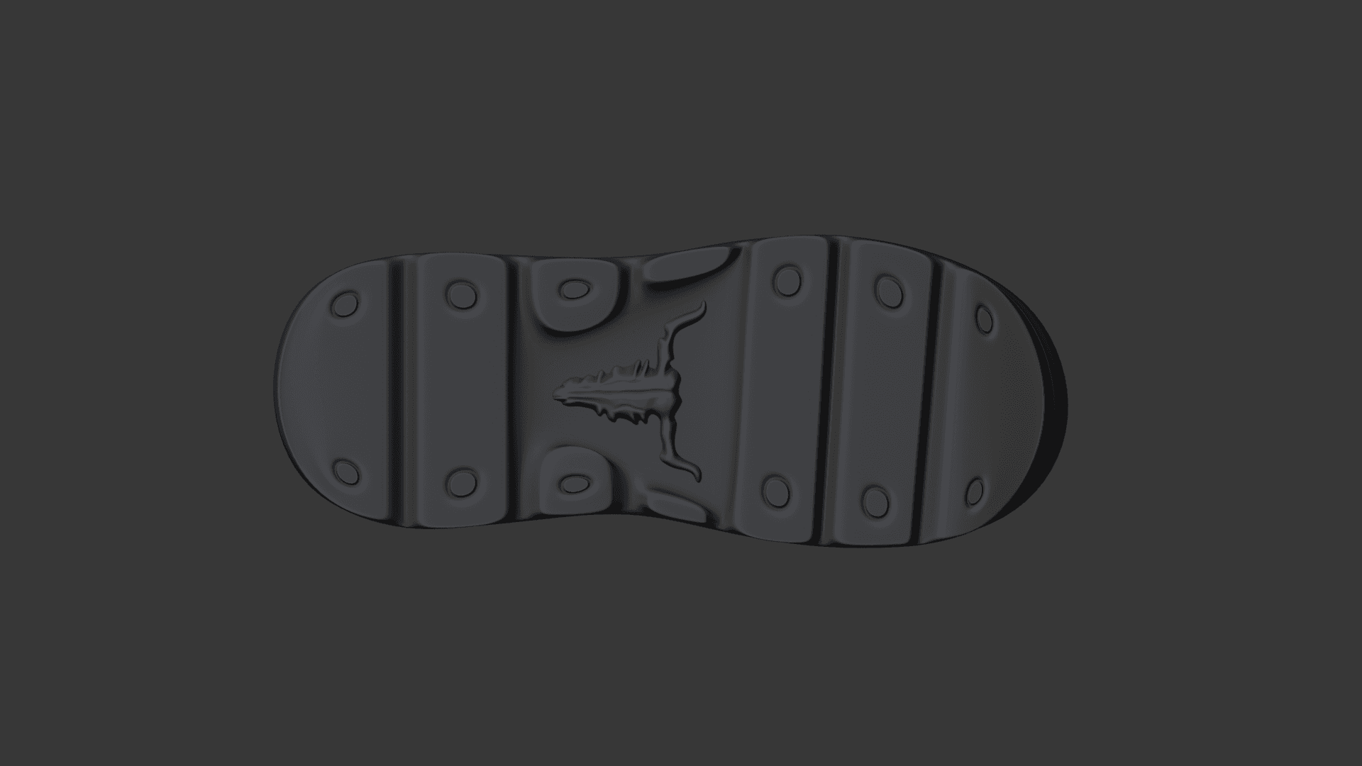 Underside of the boot showing block treads, round studs and the longhorn skull set into the middle of the sole